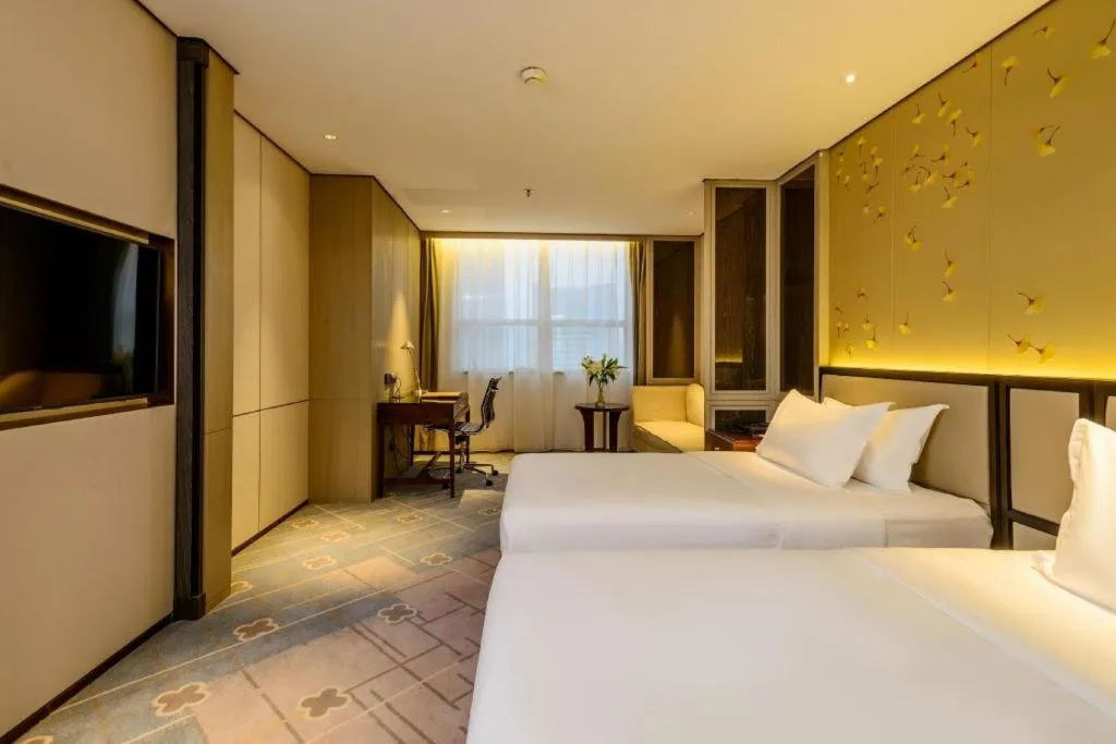 Bed in Dahe Jinjiang Hotel