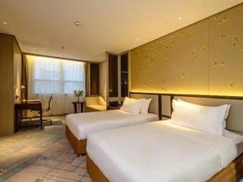 Bed in Dahe Jinjiang Hotel