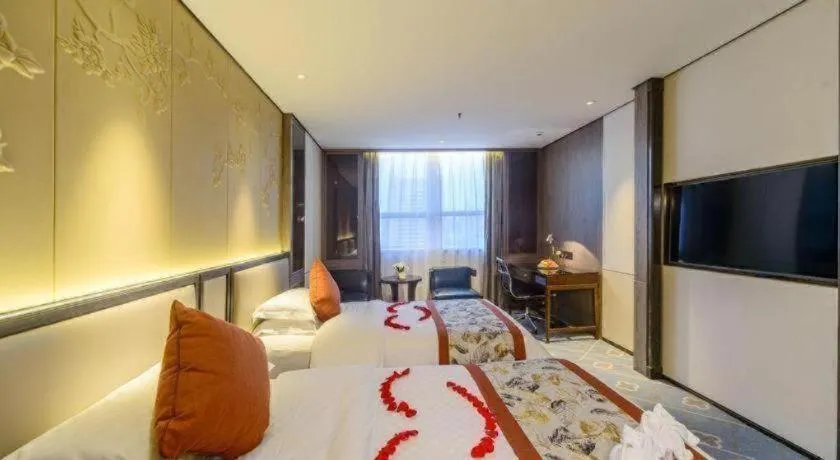 Bed in Dahe Jinjiang Hotel
