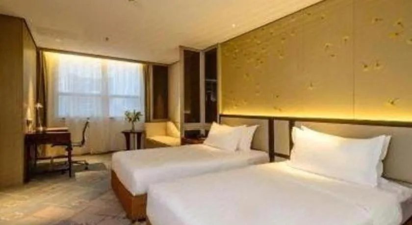 Bed in Dahe Jinjiang Hotel