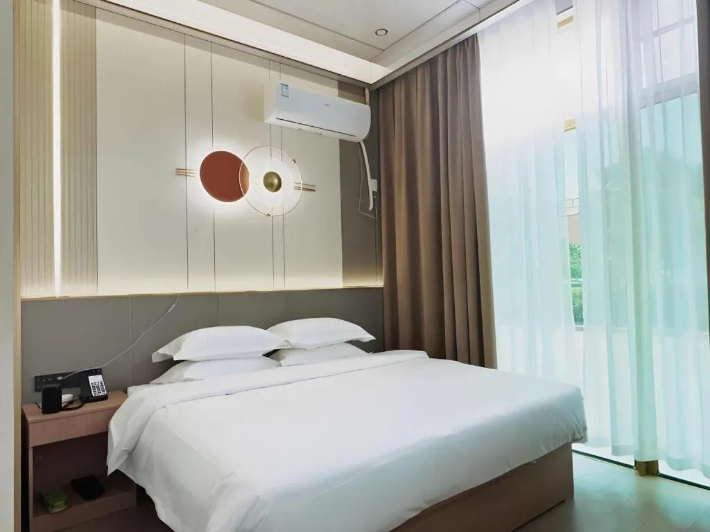 Bed in Shell Hotel Nanyang High-Speed Railway Station Jiangying Airport Huayaocheng