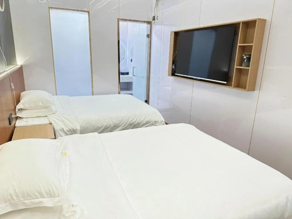 Bed in Shell Hotel Nanyang High-Speed Railway Station Jiangying Airport Huayaocheng