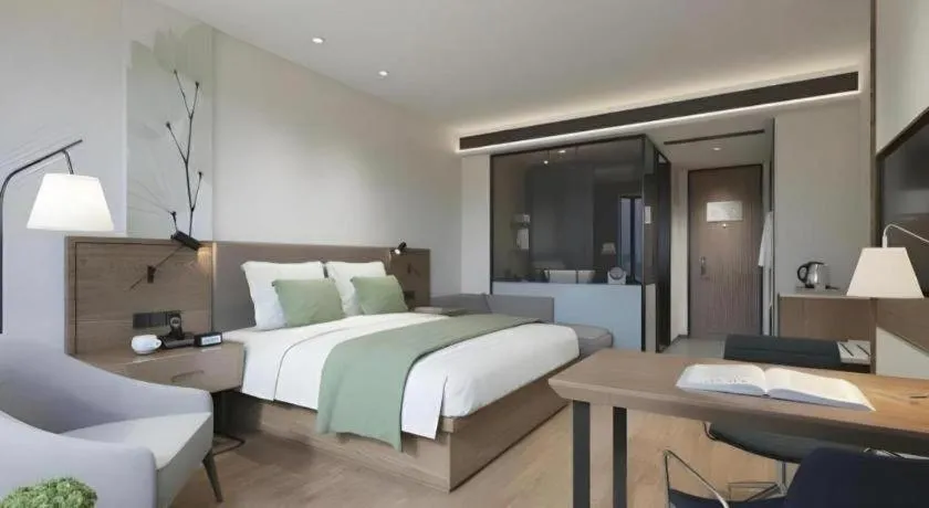 Bed in GreenTree Inn Tangshan Nanhu International Exhibition Center