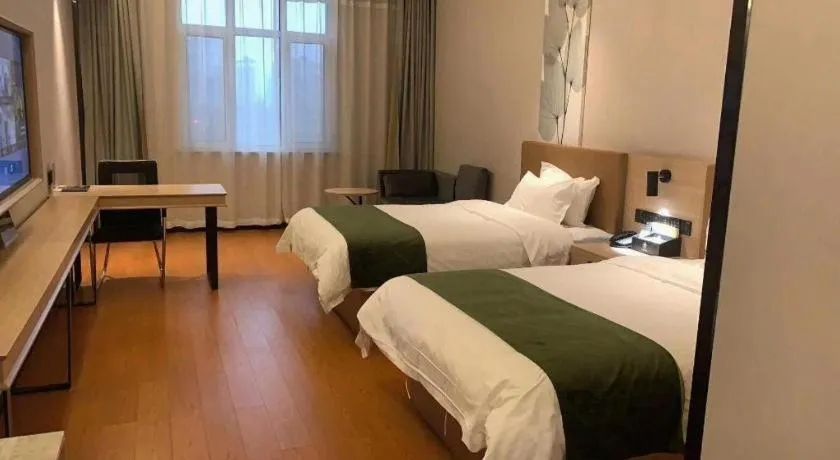 Bed in GreenTree Inn Tangshan Nanhu International Exhibition Center