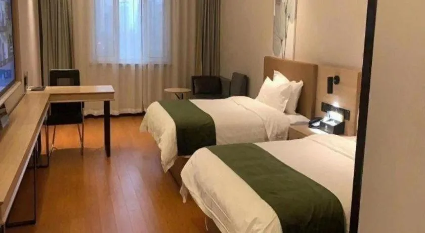 Bed in GreenTree Inn Tangshan Nanhu International Exhibition Center