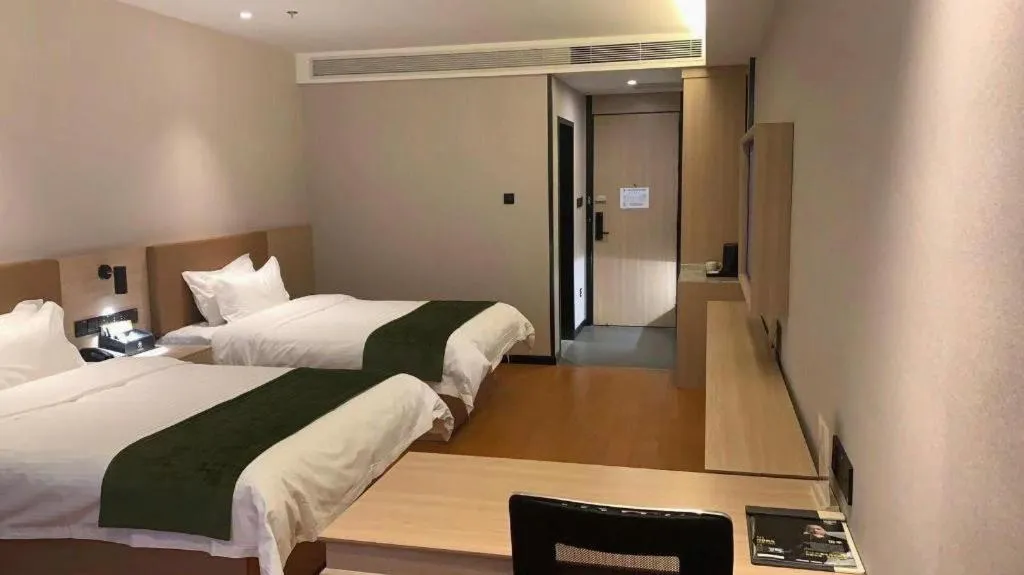 Bed in GreenTree Inn Tangshan Nanhu International Exhibition Center