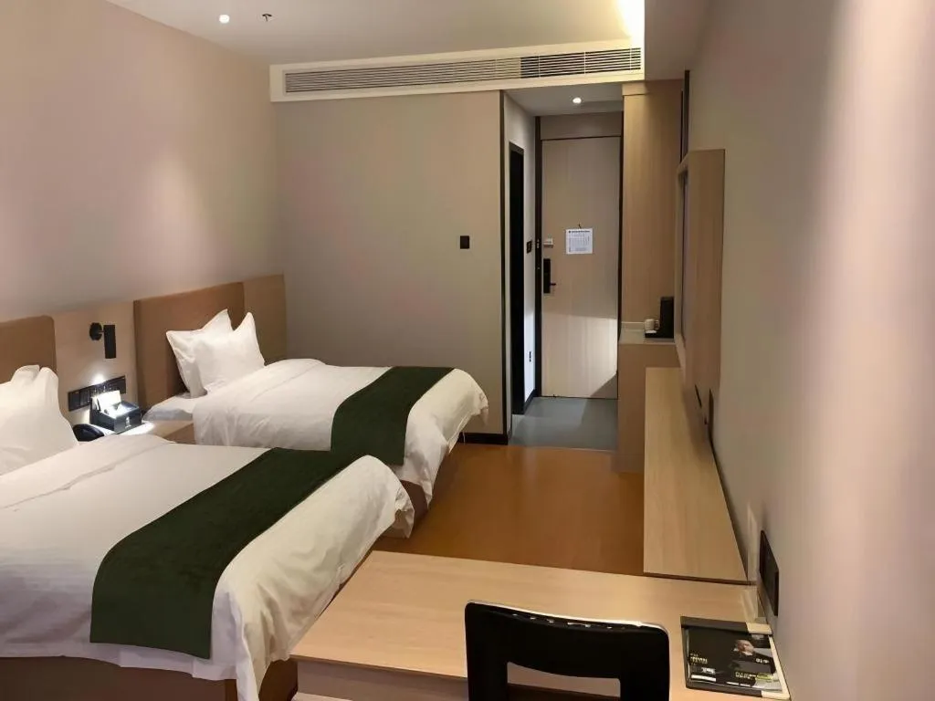 Bed in GreenTree Inn Tangshan Nanhu International Exhibition Center