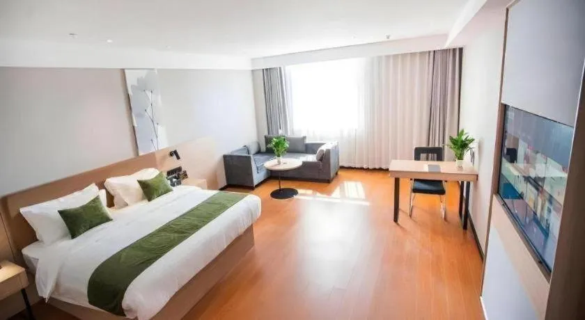 Bed in GreenTree Inn Tangshan Nanhu International Exhibition Center