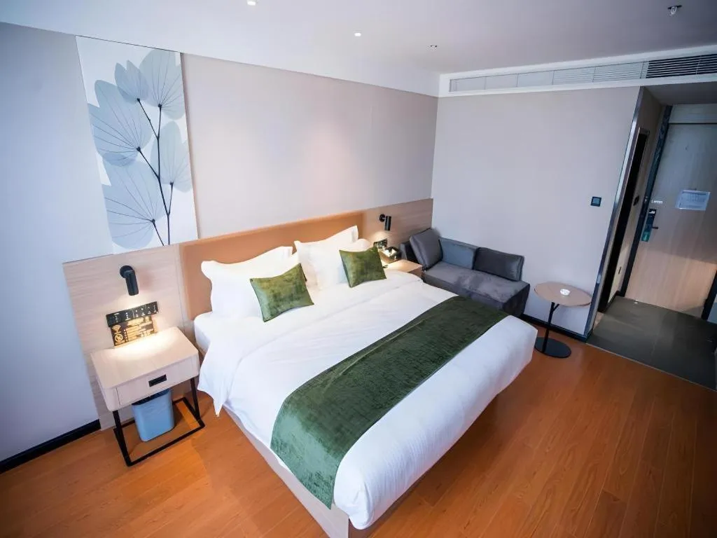 Bed in GreenTree Inn Tangshan Nanhu International Exhibition Center