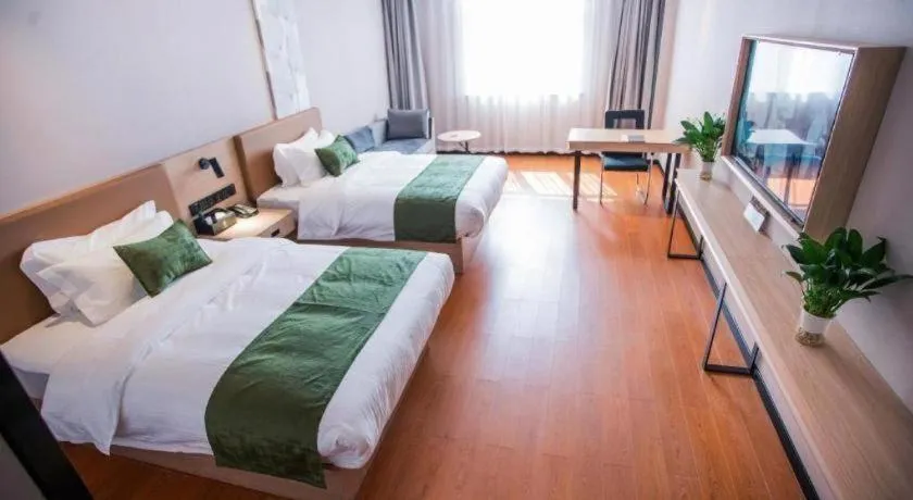 Bed in GreenTree Inn Tangshan Nanhu International Exhibition Center