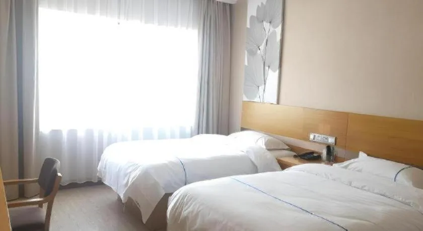 Bed in GreenTree Inn Express Shanghai Baoshan District Youyi Road Metro Station