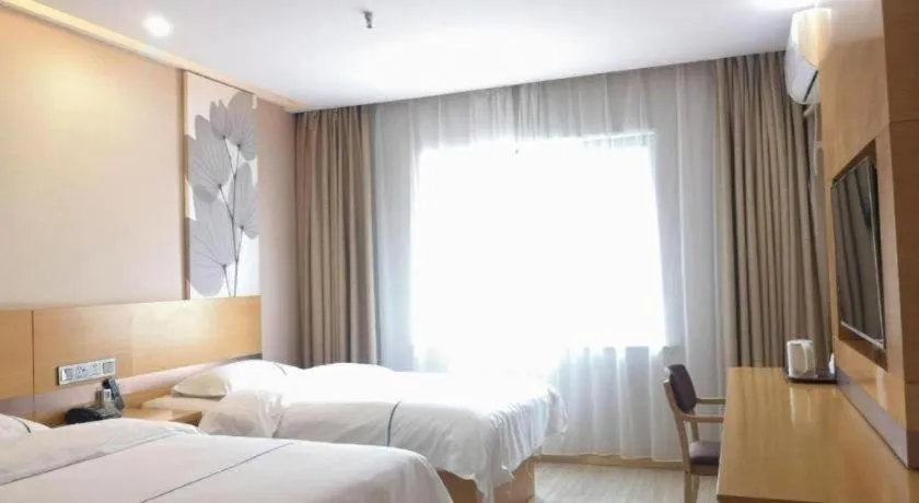 Bed in GreenTree Inn Express Shanghai Baoshan District Youyi Road Metro Station