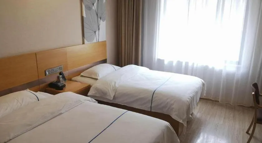Bed in GreenTree Inn Express Shanghai Baoshan District Youyi Road Metro Station