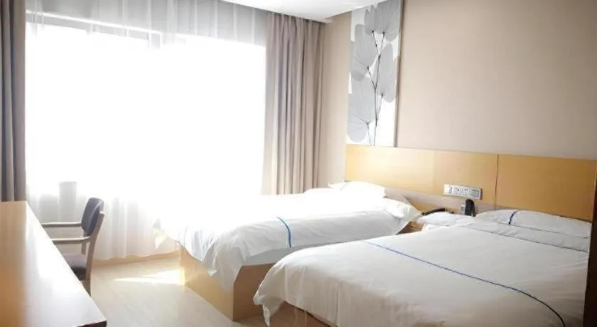 Bed in GreenTree Inn Express Shanghai Baoshan District Youyi Road Metro Station