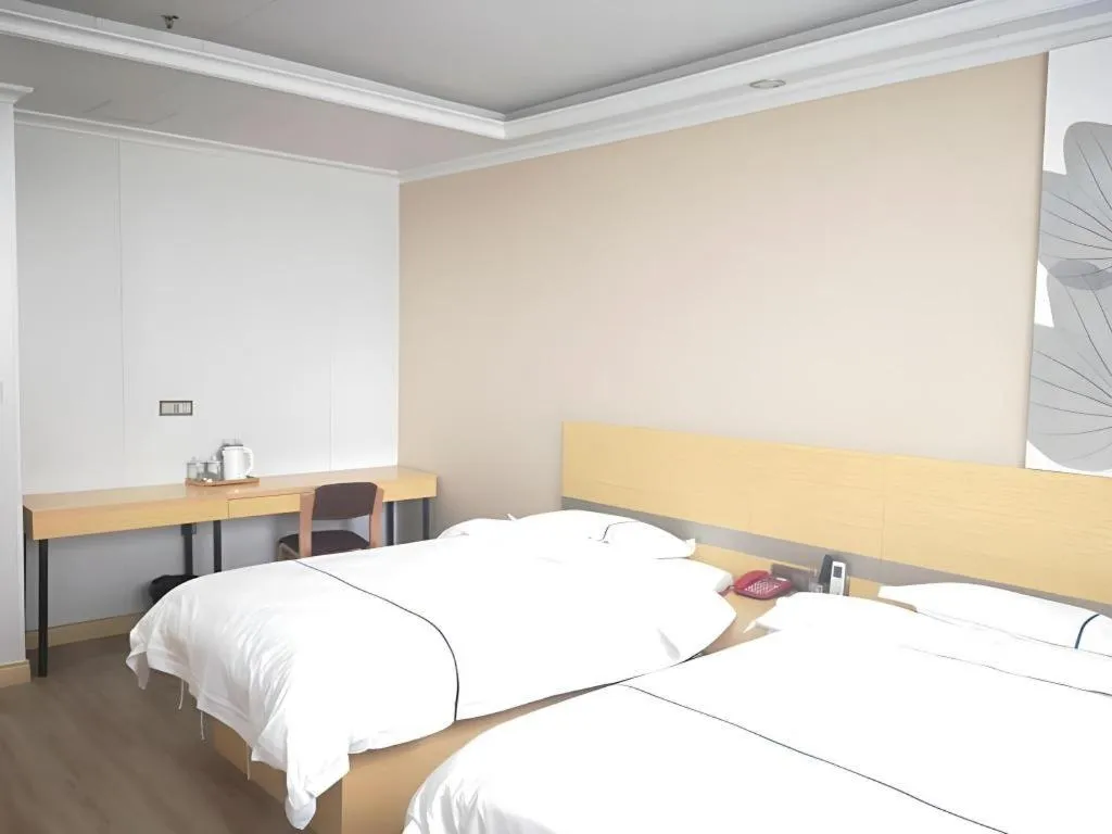 Bed in GreenTree Inn Express Shanghai Baoshan District Youyi Road Metro Station