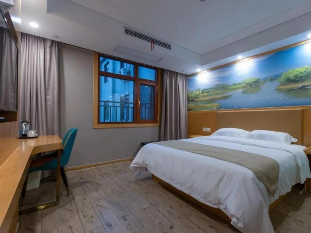 Bed in Shell Hotel Changzhou North Railway Station Global Harbor Metro Station