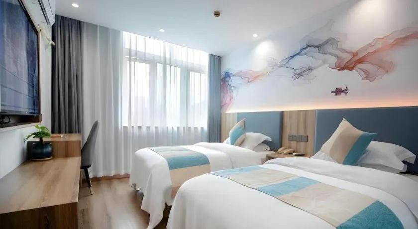 Bed in VX Hotel Hangzhou Banshan