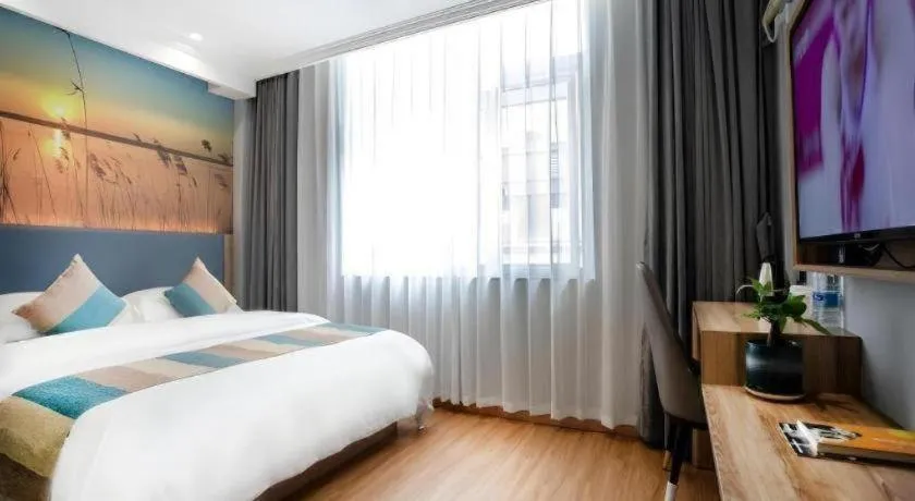 Bed in VX Hotel Hangzhou Banshan