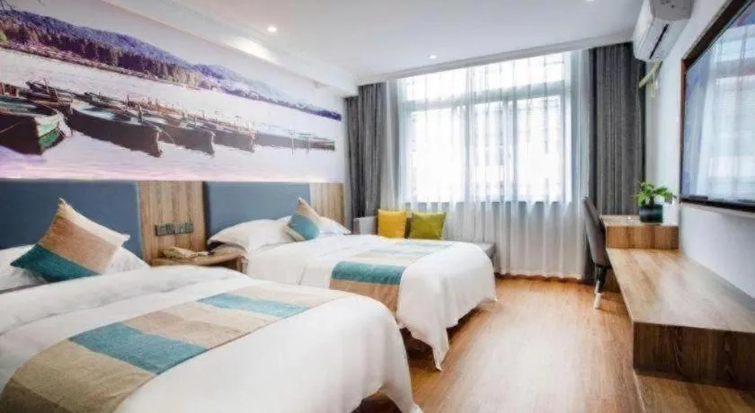 Bed in VX Hotel Hangzhou Banshan