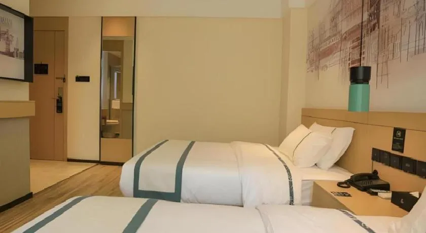 Bed in City Comfort Inn Nanchang Zhangshulin Shashagou Metro Station