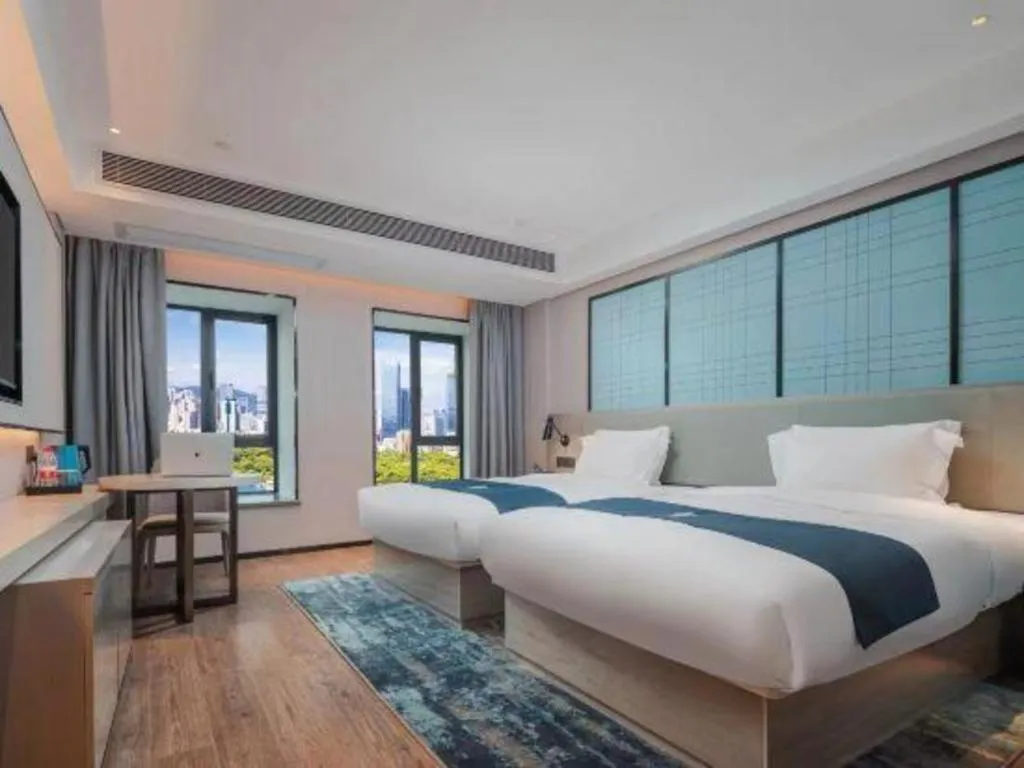 Bed in Echarm Hotel Changsha Wuyi Square Railway Metro Station