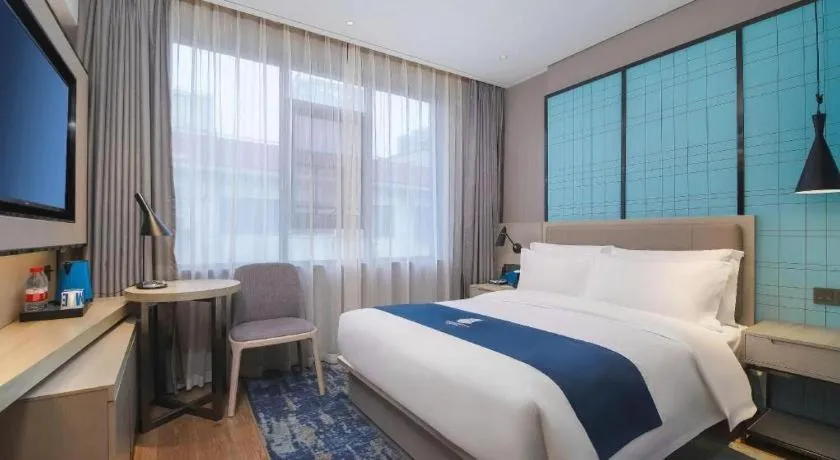 Bed in Echarm Hotel Changsha Wuyi Square Railway Metro Station