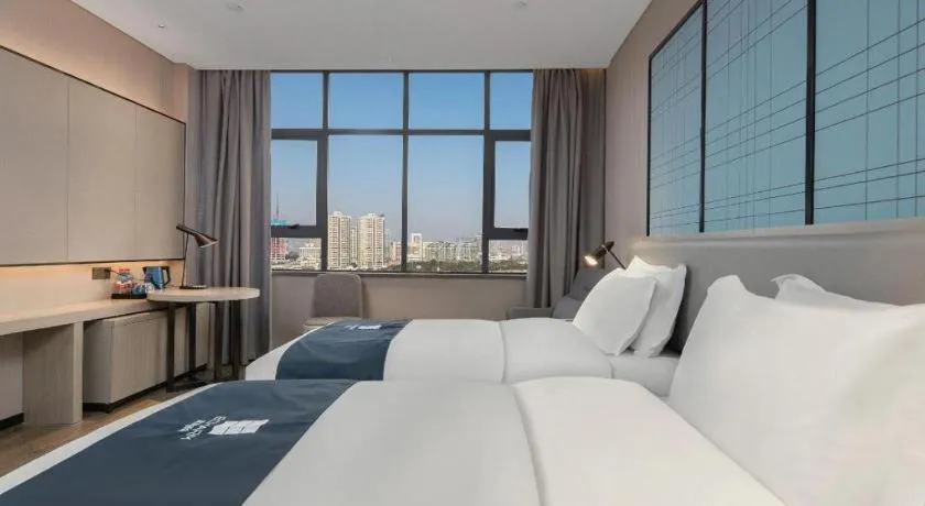 Bed in Echarm Hotel Changsha Wuyi Square Railway Metro Station