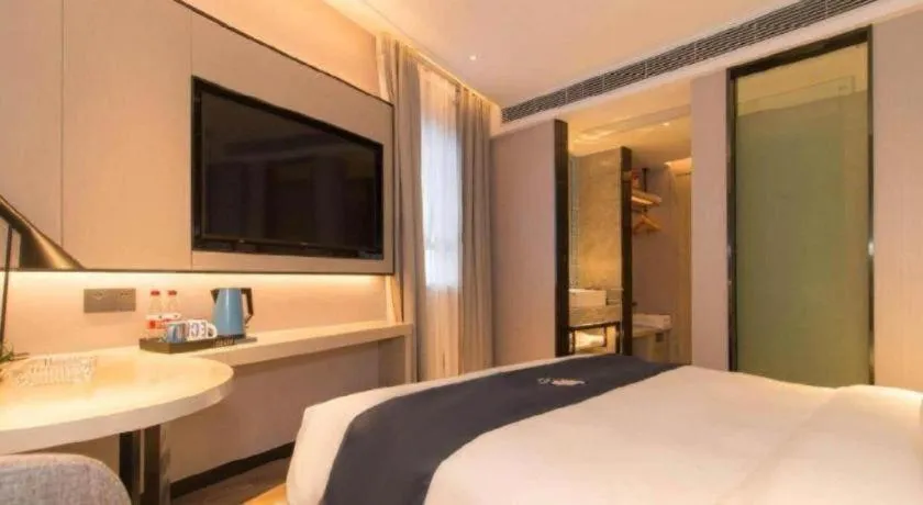 Bed in Echarm Hotel Changsha Wuyi Square Railway Metro Station