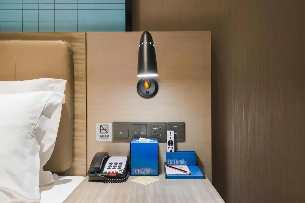 Bed in Echarm Hotel Changsha Wuyi Square Railway Metro Station