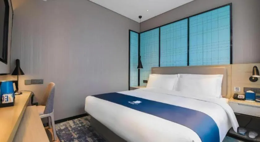 Bed in Echarm Hotel Changsha Wuyi Square Railway Metro Station