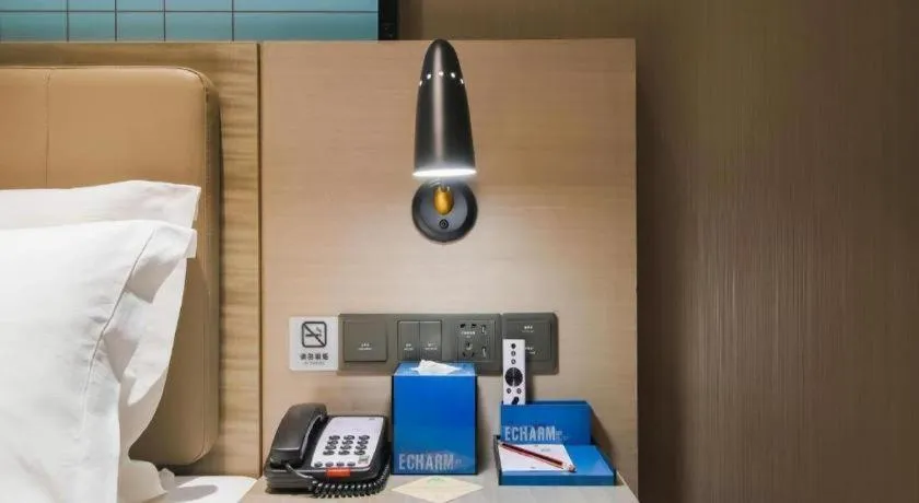 Bed in Echarm Hotel Changsha Wuyi Square Railway Metro Station