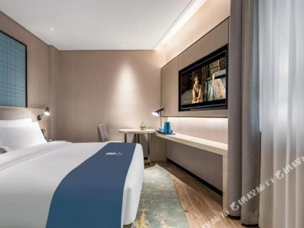 Bed in Echarm Hotel Changsha Wuyi Square Railway Metro Station