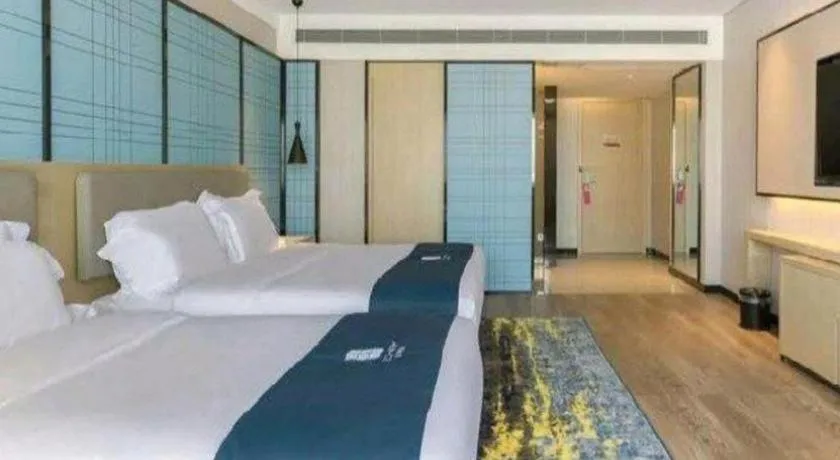 Bed in Echarm Hotel Changsha Wuyi Square Railway Metro Station