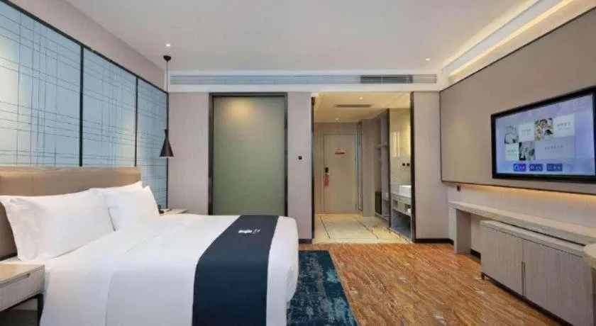 Bed in Echarm Hotel Changsha Wuyi Square Railway Metro Station