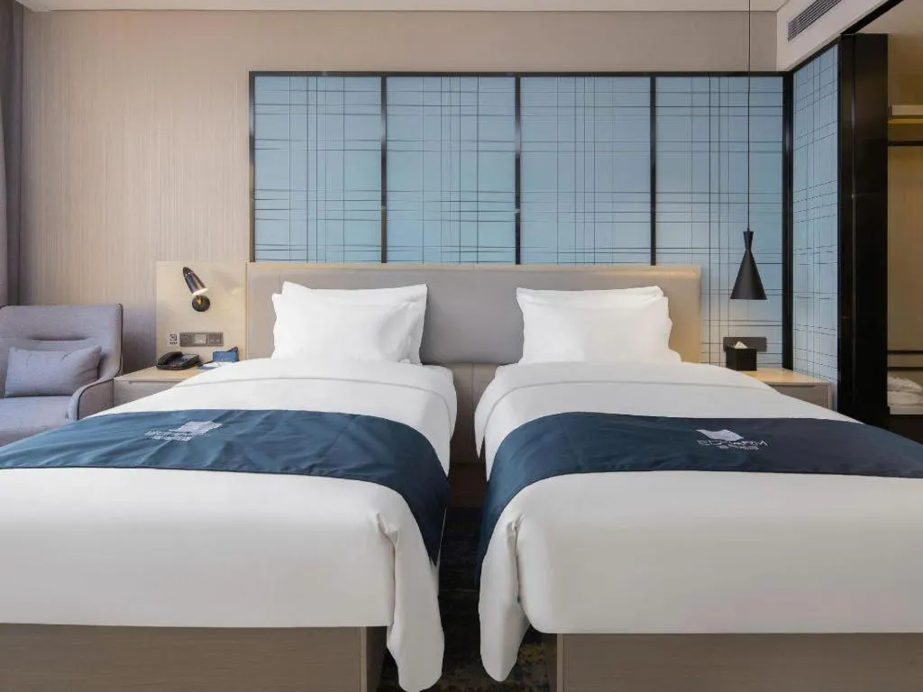 Bed in Echarm Hotel Changsha Wuyi Square Railway Metro Station