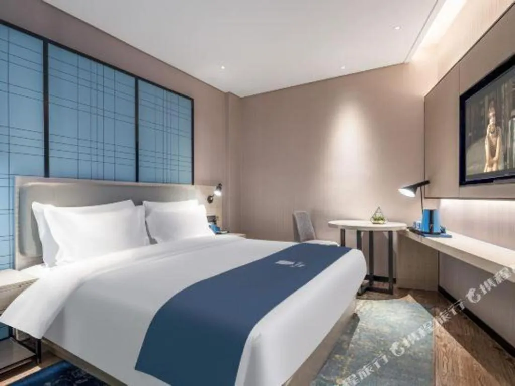 Bed in Echarm Hotel Changsha Wuyi Square Railway Metro Station
