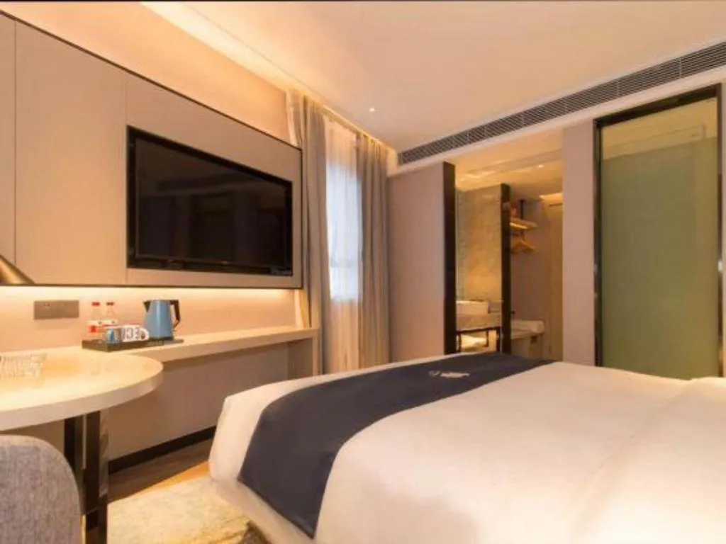 Bed in Echarm Hotel Changsha Wuyi Square Railway Metro Station