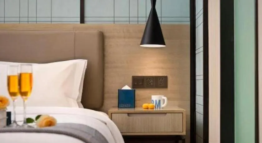 Bed in Echarm Hotel Changsha Wuyi Square Railway Metro Station