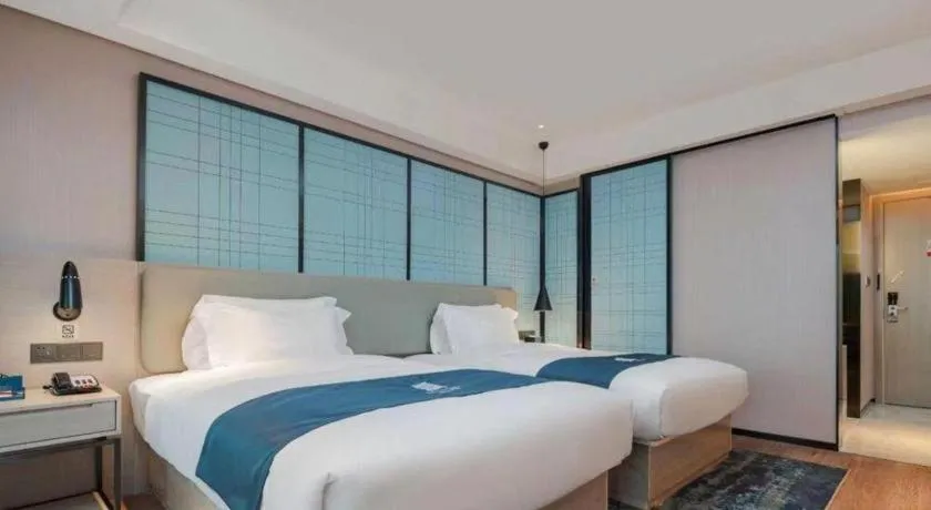 Bed in Echarm Hotel Changsha Wuyi Square Railway Metro Station