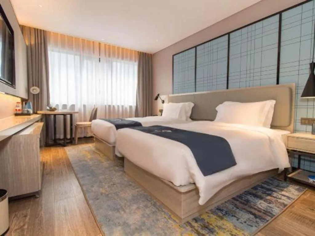 Bed in Echarm Hotel Changsha Wuyi Square Railway Metro Station