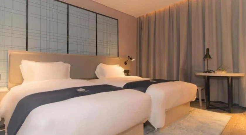 Bed in Echarm Hotel Changsha Wuyi Square Railway Metro Station