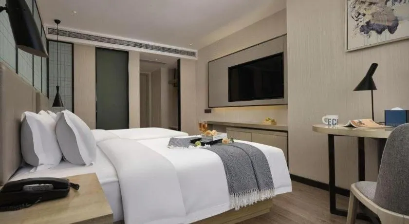 Bed in Echarm Hotel Changsha Wuyi Square Railway Metro Station