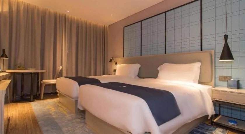 Bed in Echarm Hotel Changsha Wuyi Square Railway Metro Station
