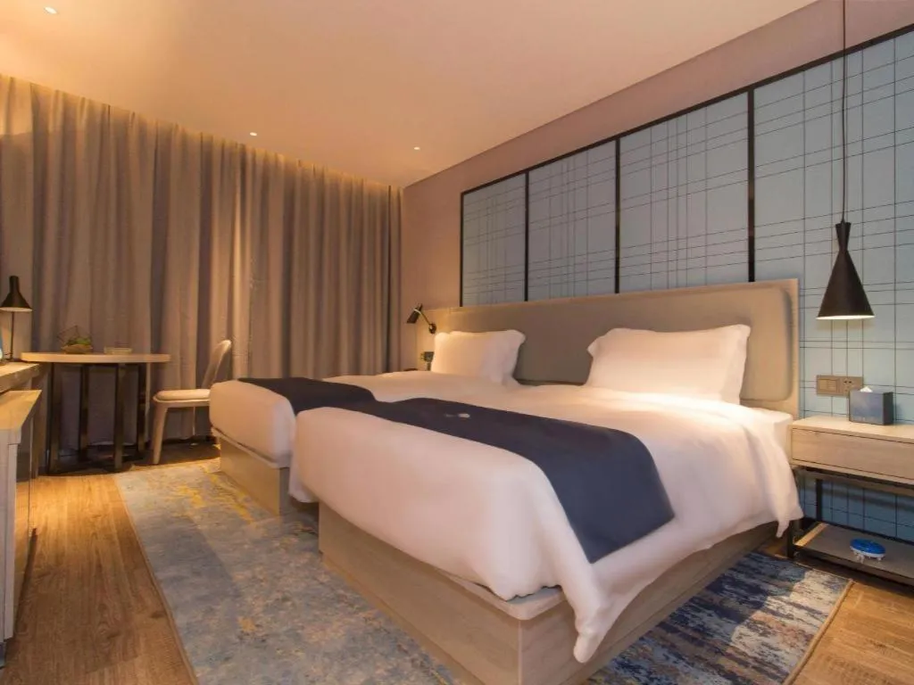 Bed in Echarm Hotel Changsha Wuyi Square Railway Metro Station
