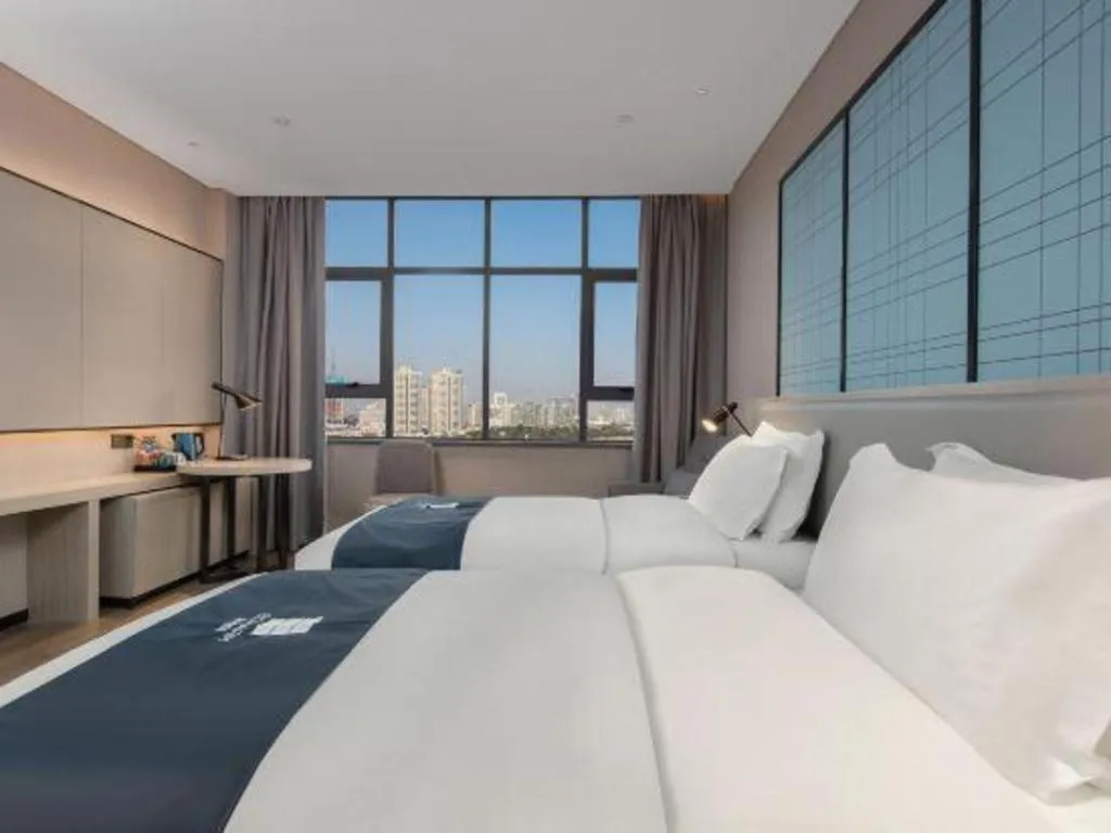 Bed in Echarm Hotel Changsha Wuyi Square Railway Metro Station