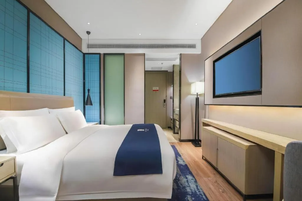 Bed in Echarm Hotel Changsha Wuyi Square Railway Metro Station