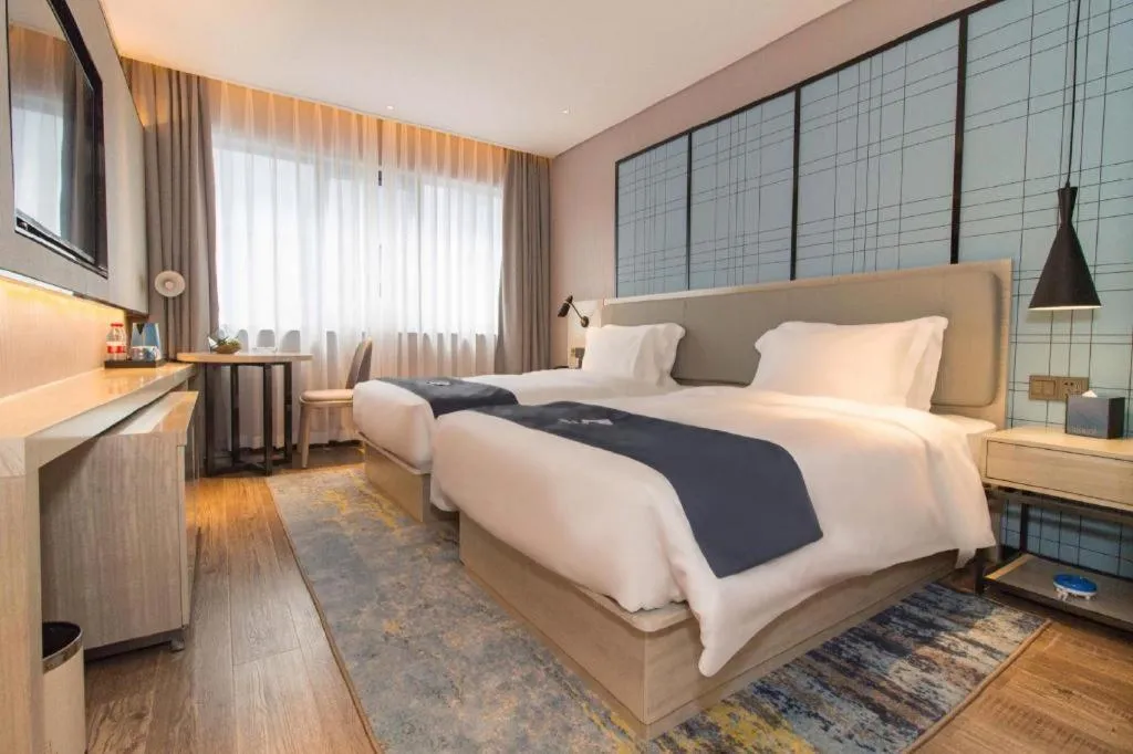 Bed in Echarm Hotel Changsha Wuyi Square Railway Metro Station