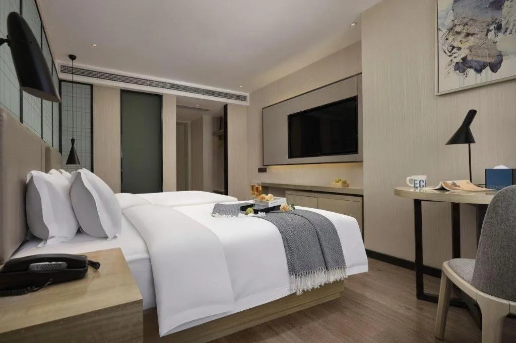 Bed in Echarm Hotel Changsha Wuyi Square Railway Metro Station