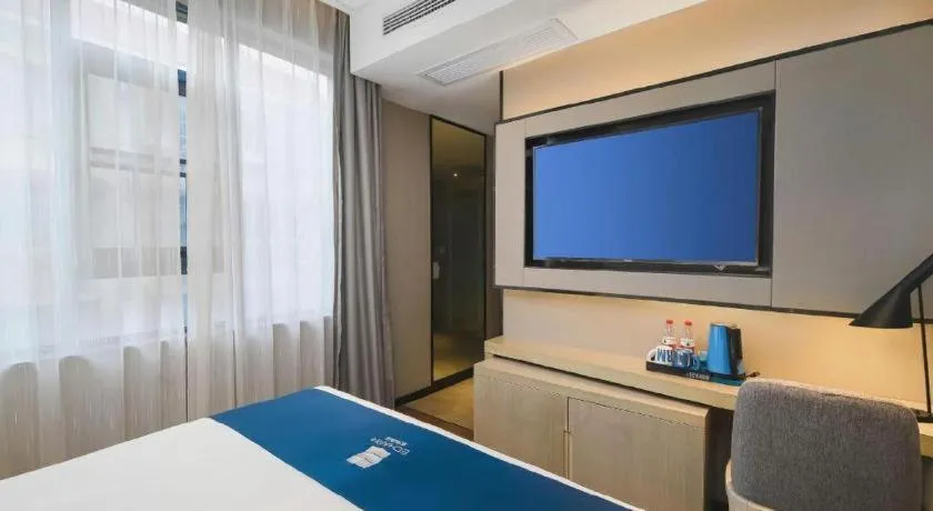 Bed in Echarm Hotel Changsha Wuyi Square Railway Metro Station
