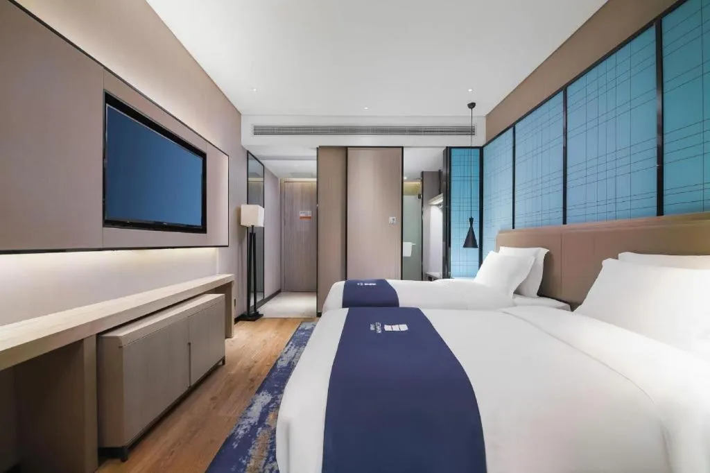 Bed in Echarm Hotel Changsha Wuyi Square Railway Metro Station
